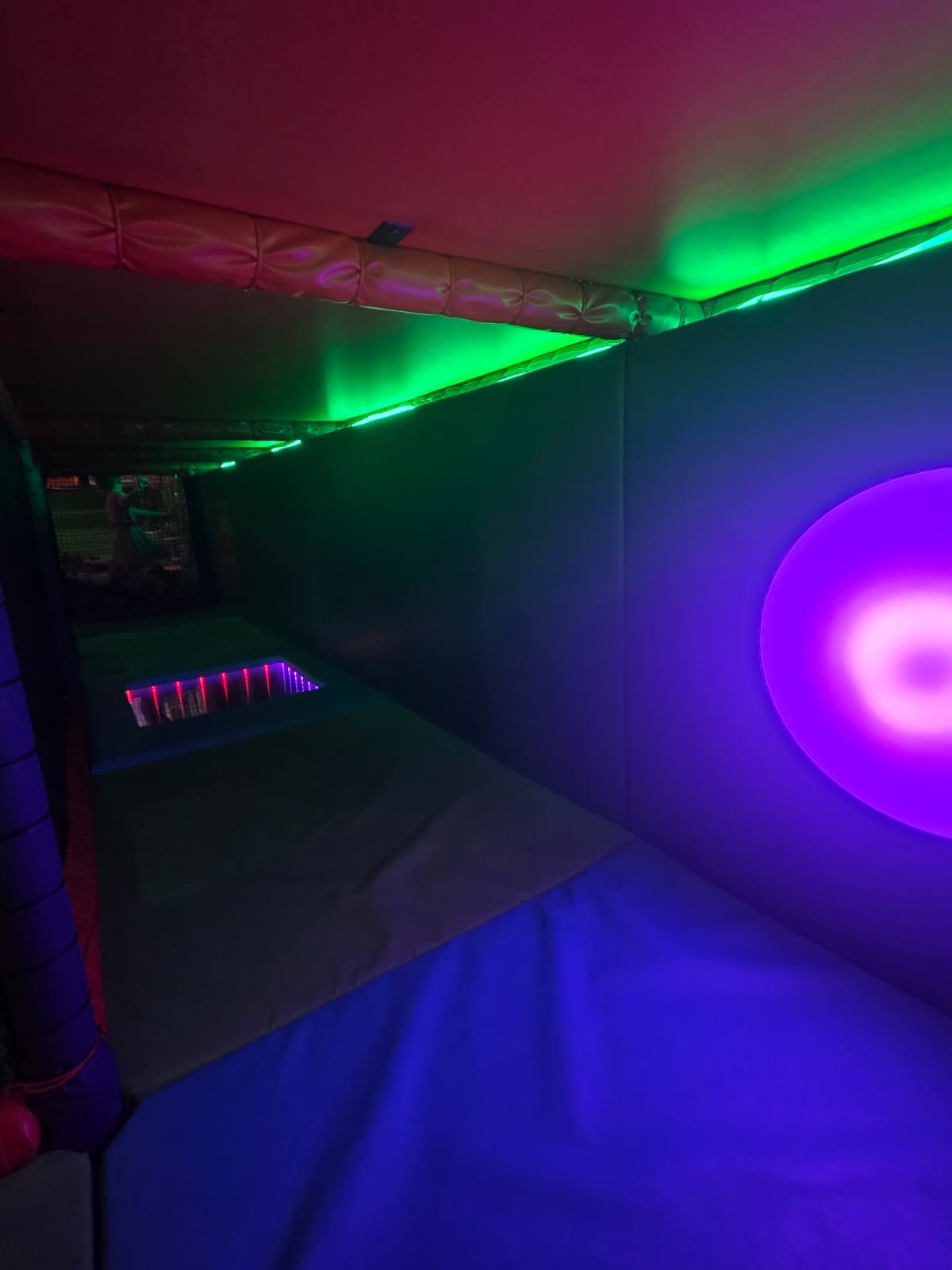 Neon-lit soft play den